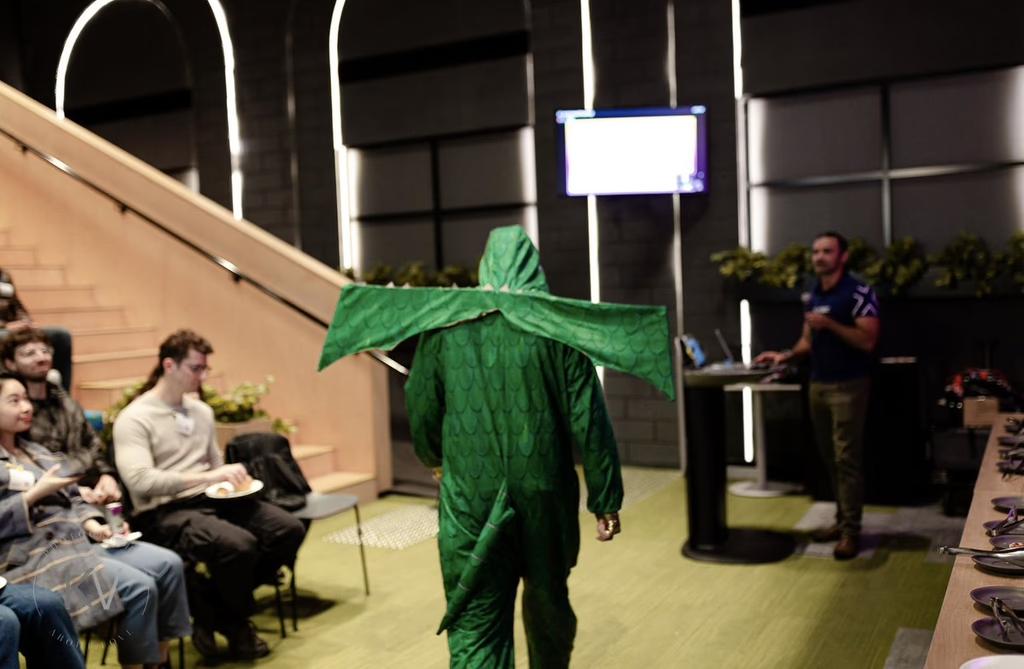 Presenter in dragon costume at Solana ANZ event